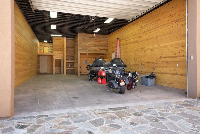 garage featuring wooden walls