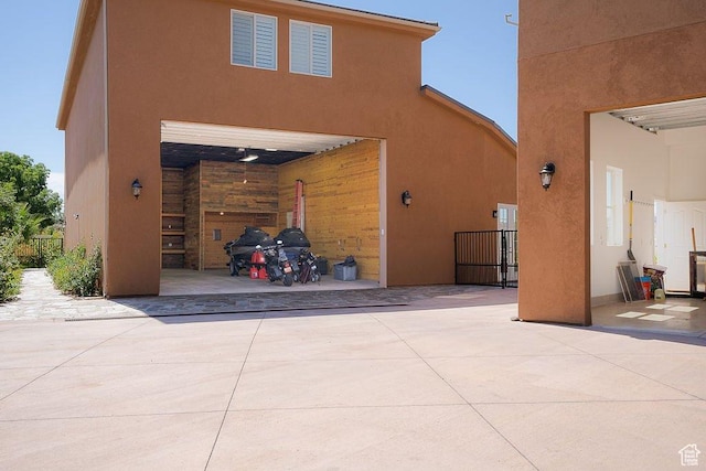 exterior space featuring stucco siding and a garage
