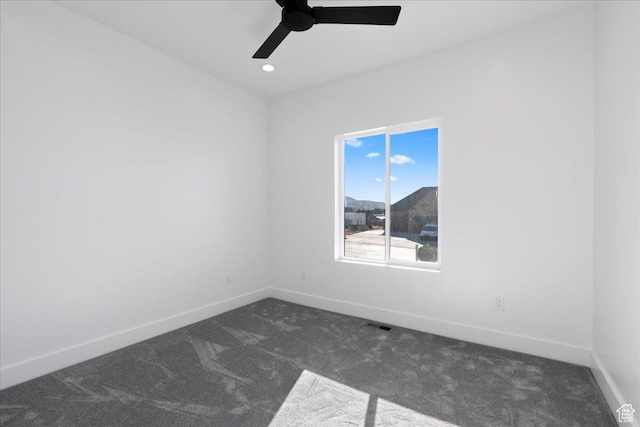 unfurnished room with a ceiling fan, dark colored carpet, baseboards, visible vents, and recessed lighting