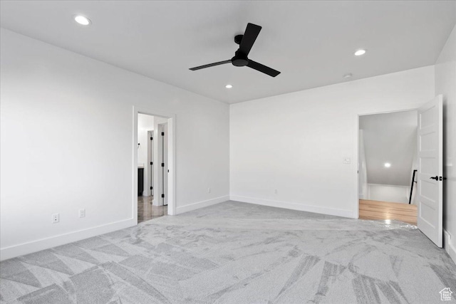 empty room featuring recessed lighting, carpet floors, baseboards, and ceiling fan