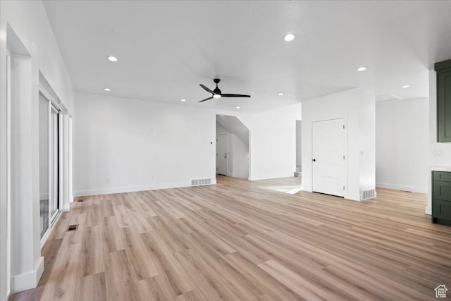 unfurnished living room featuring light wood-type flooring, recessed lighting, and a ceiling fan