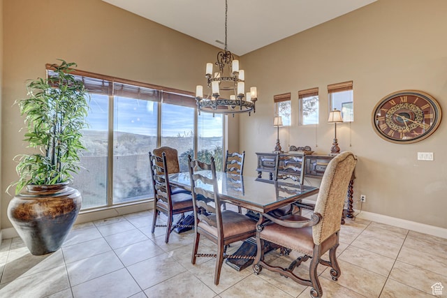 4985 W Boulder Vw, Hurricane, UT 84737 - dining space with baseboards, vaulted ceiling, light tile patterned floors, and a chandelier