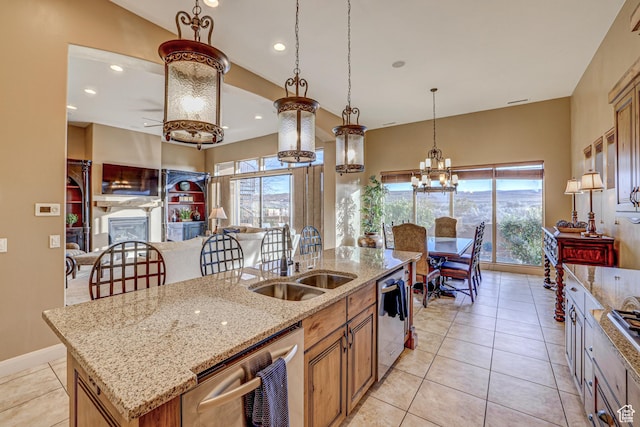 4985 W Boulder Vw, Hurricane, UT 84737 - kitchen featuring dishwasher, open floor plan, a sink, and a center island with sink