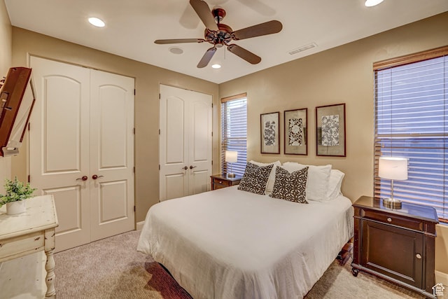 4985 W Boulder Vw, Hurricane, UT 84737 - carpeted bedroom with visible vents, two closets, recessed lighting, and a ceiling fan