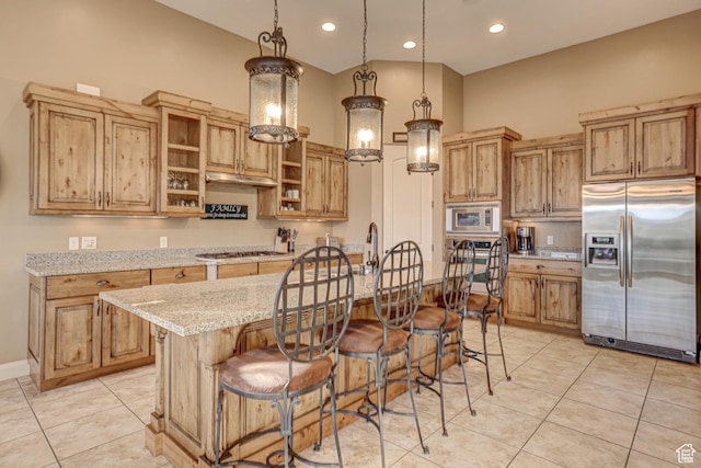 4985 W Boulder Vw, Hurricane, UT 84737 - kitchen with a breakfast bar, stainless steel appliances, light tile patterned floors, and light stone counters