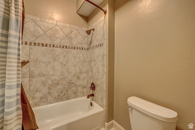 4985 W Boulder Vw, Hurricane, UT 84737 - bathroom featuring toilet, shower / bathtub combination with curtain, a textured wall, and baseboards