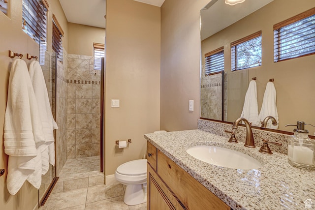 4985 W Boulder Vw, Hurricane, UT 84737 - full bath featuring baseboards, toilet, tile patterned floors, vanity, and tiled shower