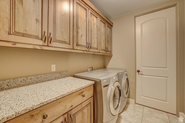4985 W Boulder Vw, Hurricane, UT 84737 - washroom with light tile patterned flooring, cabinet space, baseboards, and washer and clothes dryer
