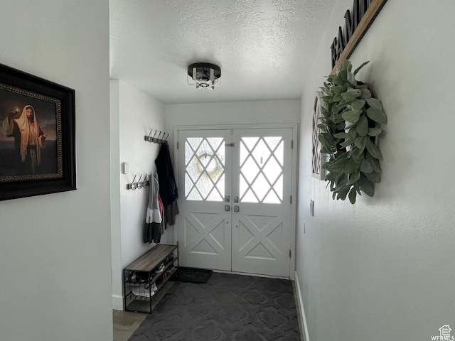 466 W 200 N, Logan, UT 84321 - entryway with baseboards, a textured ceiling, and carpet