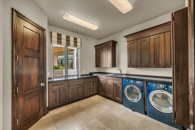 2196 W Long Sky Dr, St George, UT 84770 - laundry room featuring cabinet space, light tile patterned floors, washing machine and dryer, and a sink