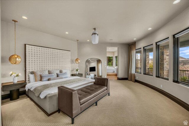 2196 W Long Sky Dr, St George, UT 84770 - bedroom featuring arched walkways, baseboards, light carpet, and recessed lighting