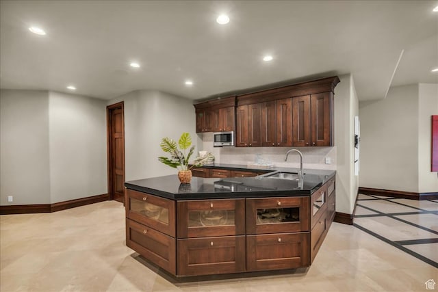 2196 W Long Sky Dr, St George, UT 84770 - kitchen with stainless steel microwave, baseboards, recessed lighting, decorative backsplash, and a sink