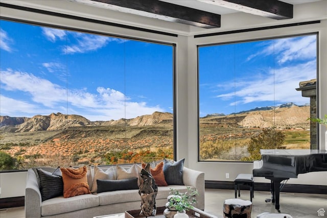 2196 W Long Sky Dr, St George, UT 84770 - living area featuring a mountain view, baseboards, and beamed ceiling