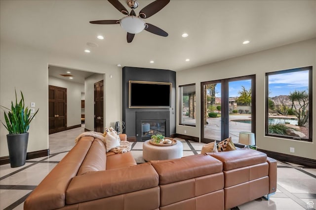 2196 W Long Sky Dr, St George, UT 84770 - living room featuring a large fireplace, baseboards, recessed lighting, and ceiling fan