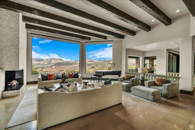 2196 W Long Sky Dr, St George, UT 84770 - tiled living room with a mountain view, a large fireplace, and beamed ceiling