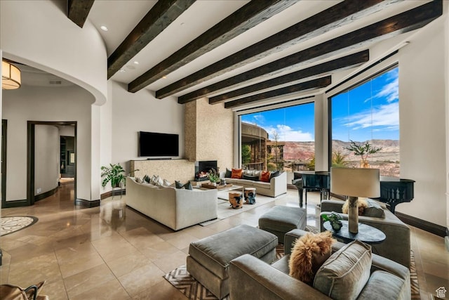 2196 W Long Sky Dr, St George, UT 84770 - living area with baseboards, recessed lighting, visible vents, beam ceiling, and arched walkways