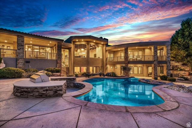 2196 W Long Sky Dr, St George, UT 84770 - pool at dusk with a patio area and an outdoor pool