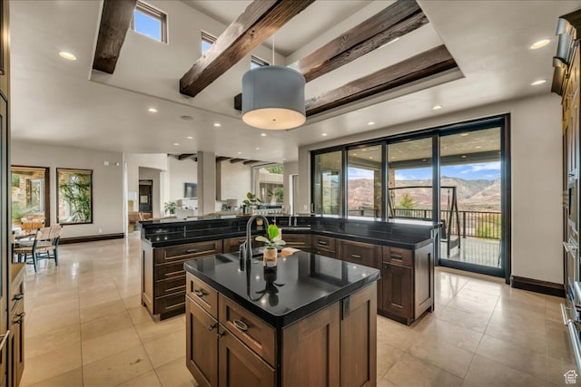 2196 W Long Sky Dr, St George, UT 84770 - kitchen with open floor plan, a center island with sink, light tile patterned flooring, and baseboards