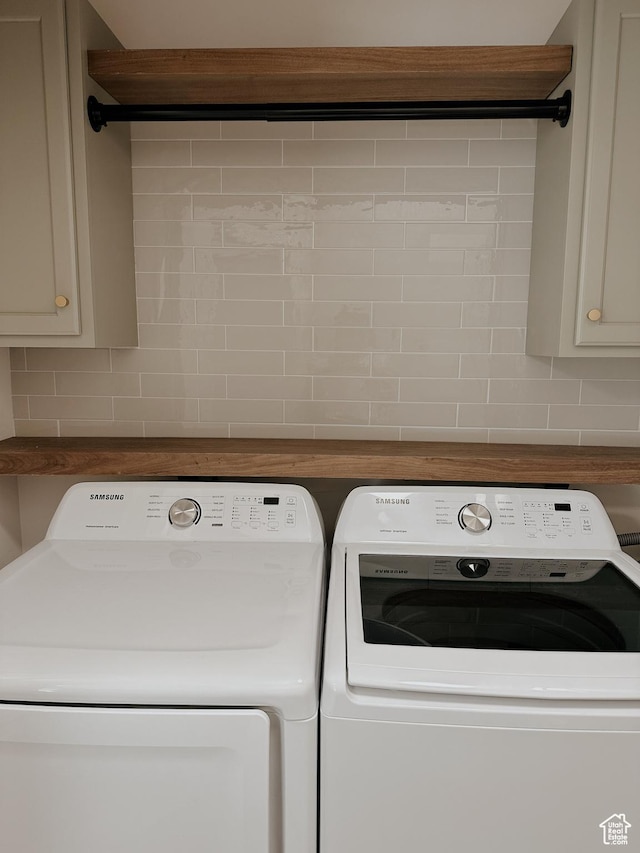 laundry area featuring cabinet space and separate washer and dryer