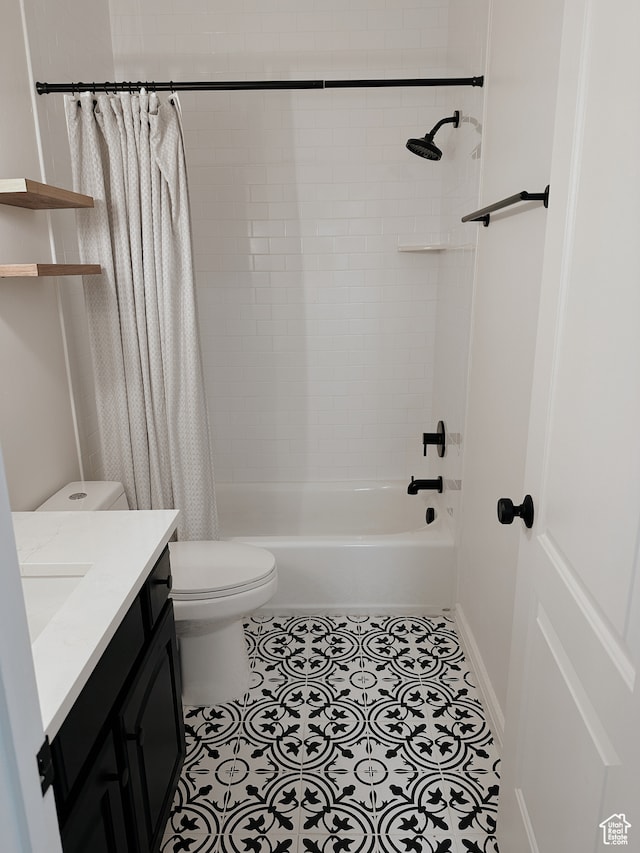 full bath with tile patterned flooring, vanity, toilet, baseboards, and shower / bath combo