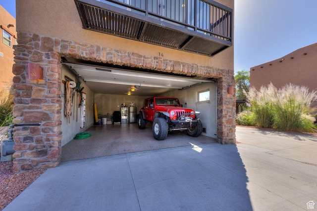 1261 N Main Rubicon Trl Unit M-14, Moab, UT 84532 - view of parking with a garage and concrete driveway