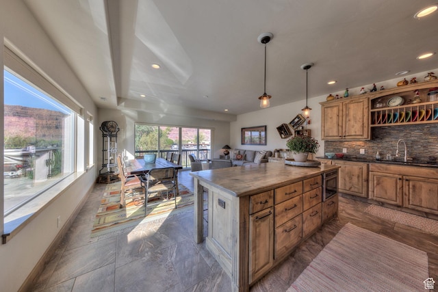 1261 N Main Rubicon Trl Unit M-14, Moab, UT 84532 - kitchen featuring a sink, built in microwave, a center island, recessed lighting, and open floor plan