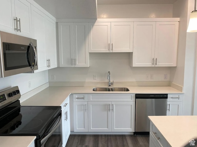 875 S Depot St Unit C212, Clearfield, UT 84015 - kitchen with pendant lighting, sink, white cabinetry, appliances with stainless steel finishes, and dark hardwood / wood-style flooring