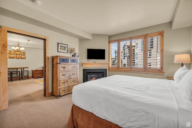 2669 Canyons Resort Dr Unit 206Abc, Park City, UT 84098 - bedroom with carpet floors, a notable chandelier, and a glass covered fireplace