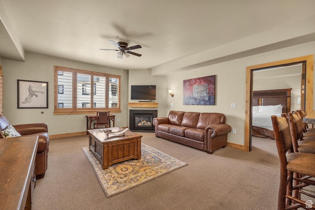 2669 Canyons Resort Dr Unit 206Abc, Park City, UT 84098 - living room with light colored carpet, baseboards, a glass covered fireplace, and a ceiling fan