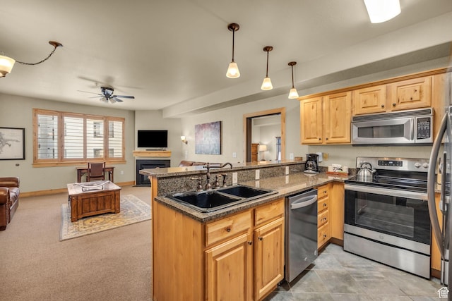 2669 Canyons Resort Dr Unit 206Abc, Park City, UT 84098 - kitchen with a peninsula, ceiling fan, appliances with stainless steel finishes, a sink, and open floor plan