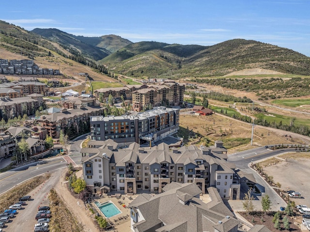 birds eye view of property with a mountain view