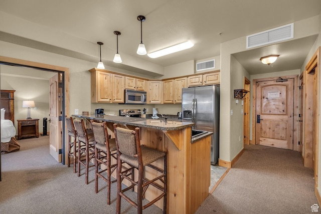 2669 Canyons Resort Dr Unit 206Abc, Park City, UT 84098 - kitchen with stainless steel appliances, light brown cabinetry, light colored carpet, and visible vents