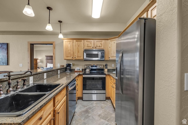 2669 Canyons Resort Dr Unit 206Abc, Park City, UT 84098 - kitchen with a textured wall, light brown cabinets, a sink, and stainless steel appliances