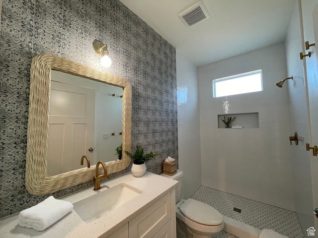 544 Lotus Dr, Fish Haven, ID 83287 - bathroom featuring vanity, toilet, and tiled shower