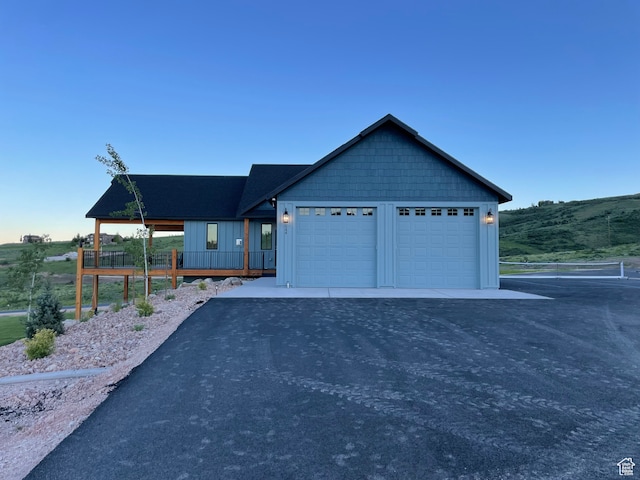 544 Lotus Dr, Fish Haven, ID 83287 - view of front facade featuring a mountain view and a garage