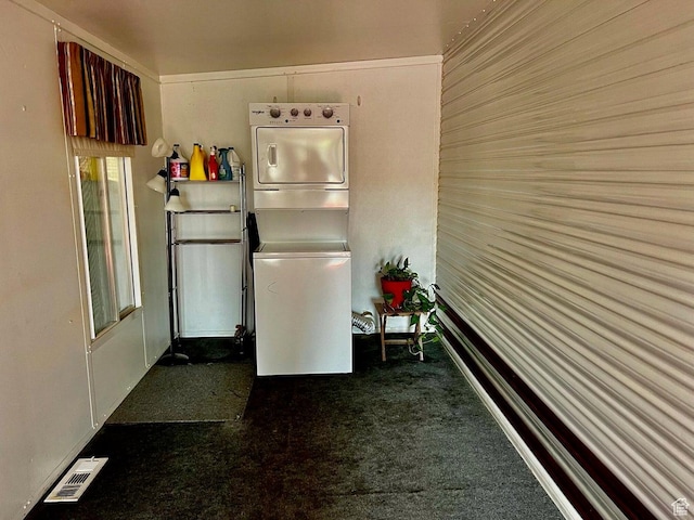 448 E Telegraph # 26, Washington, UT 84780 - kitchen featuring visible vents, stacked washer and clothes dryer, and carpet flooring