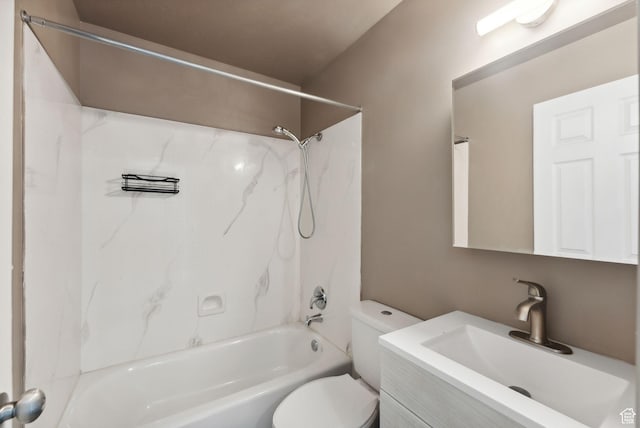 bathroom with toilet,  shower combination, and vanity
