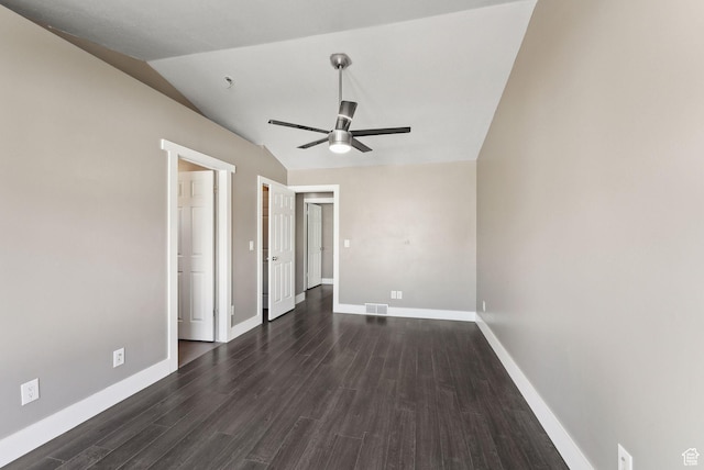 unfurnished bedroom with a ceiling fan, dark wood finished floors, visible vents, baseboards, and vaulted ceiling