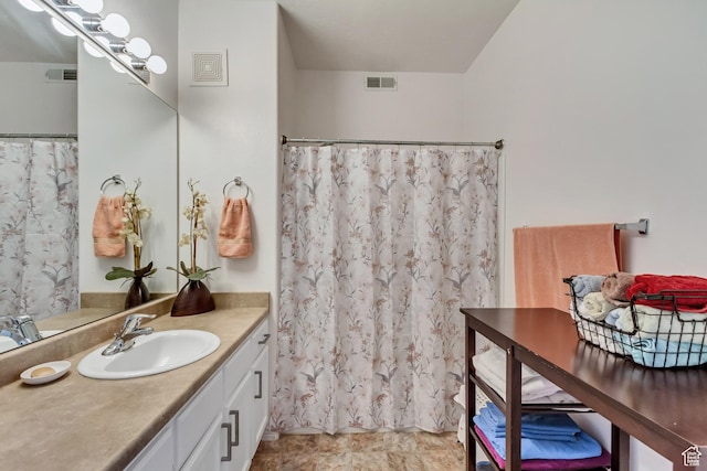 3478 S Cozy River Pl Unit 402, West Valley City, UT 84119 - bathroom with visible vents, vanity, and a shower with shower curtain
