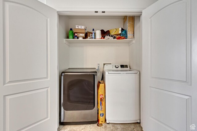 3478 S Cozy River Pl Unit 402, West Valley City, UT 84119 - laundry room with washer and dryer and laundry area