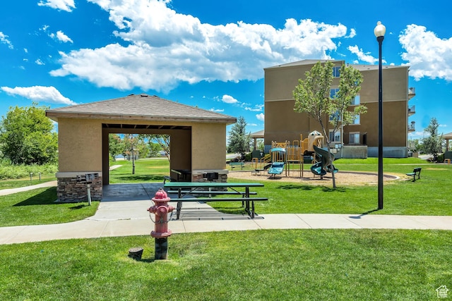 3478 S Cozy River Pl Unit 402, West Valley City, UT 84119 - view of property's community featuring playground community and a yard