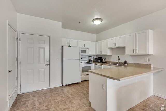 3478 S Cozy River Pl Unit 402, West Valley City, UT 84119 - kitchen with light countertops, a sink, a peninsula, white appliances, and white cabinets