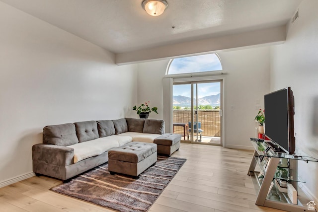 3478 S Cozy River Pl Unit 402, West Valley City, UT 84119 - living area with baseboards, visible vents, and light wood-style floors
