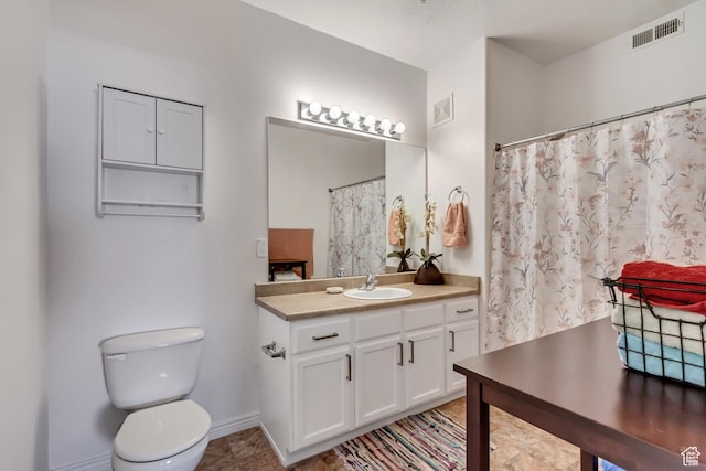 3478 S Cozy River Pl Unit 402, West Valley City, UT 84119 - bathroom with toilet, vanity, baseboards, and visible vents