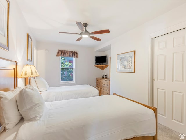bedroom featuring ceiling fan and carpet flooring