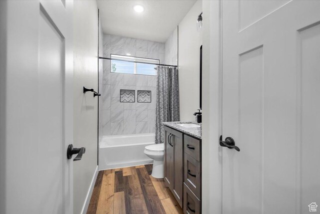 591 W 100 N, Payson, UT 84651 - full bath with shower / bath combo, baseboards, toilet, vanity, and wood finished floors