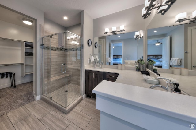 420 N 600 W, Moab, UT 84532 - ensuite bathroom with a stall shower, a ceiling fan, vanity, and recessed lighting