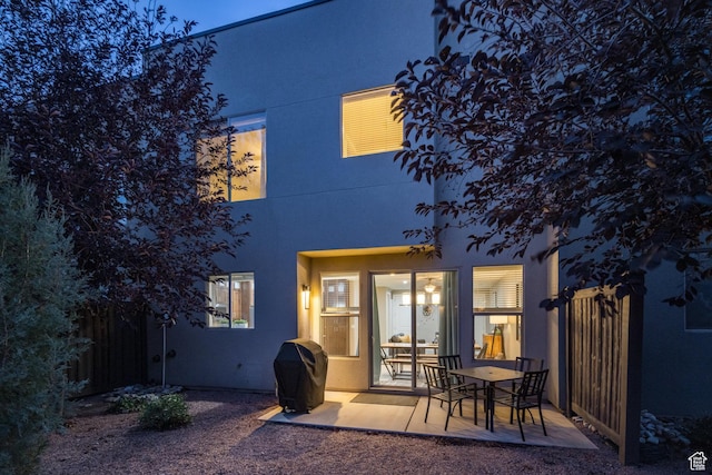 420 N 600 W, Moab, UT 84532 - rear view of house with stucco siding and a patio