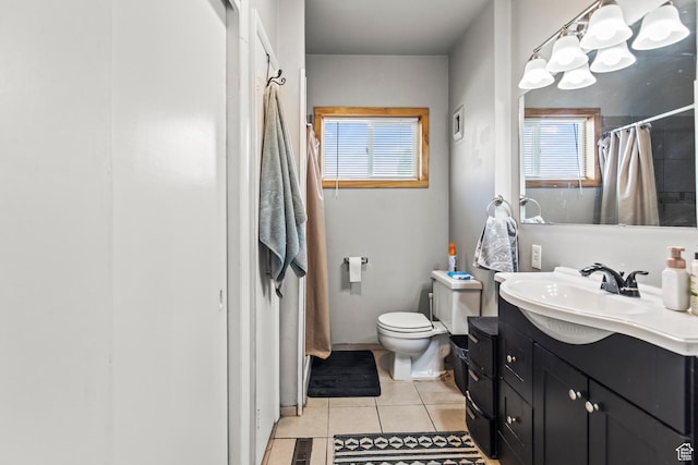full bath with visible vents, toilet, vanity, a shower with curtain, and tile patterned flooring
