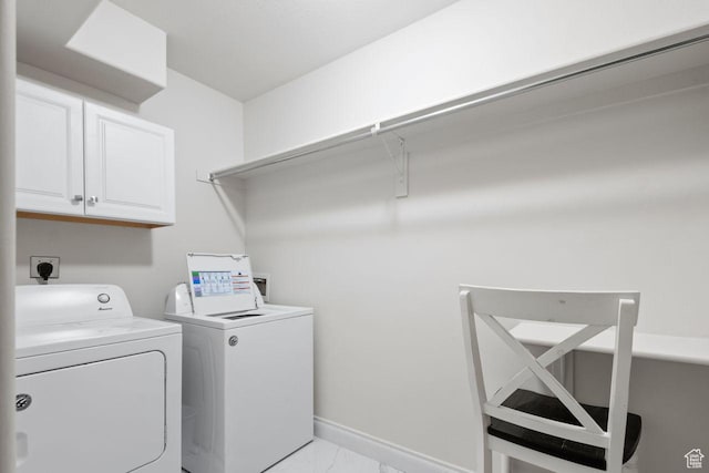 10575 S Alexander Park Ln, South Jordan, UT 84095 - laundry area featuring washer and clothes dryer, marble finish floor, baseboards, and cabinet space